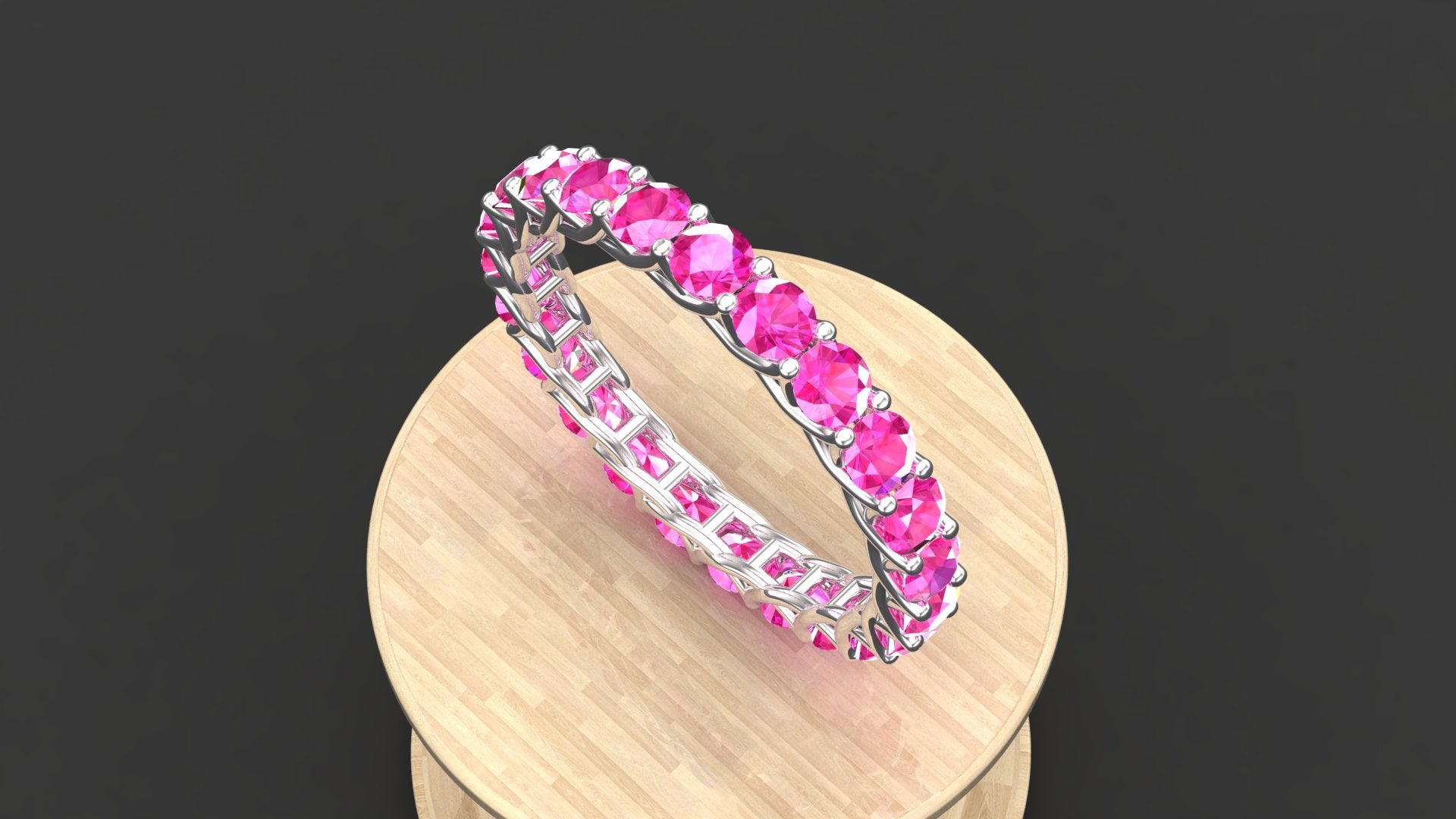 "Amara" sterling silver stacking ring with a full circle of pink tourmaline stones.