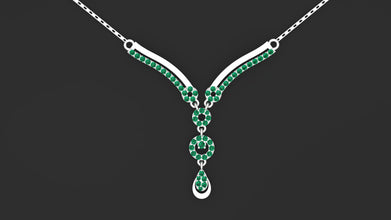 Custom Amira necklace in 925 silver with emerald green stones.
