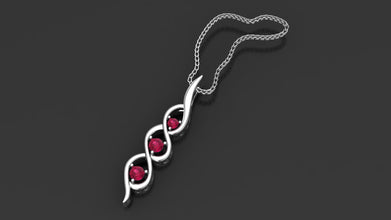 Minzaari Jewels' Kaia three-stone pendant with passionate ruby red gems.