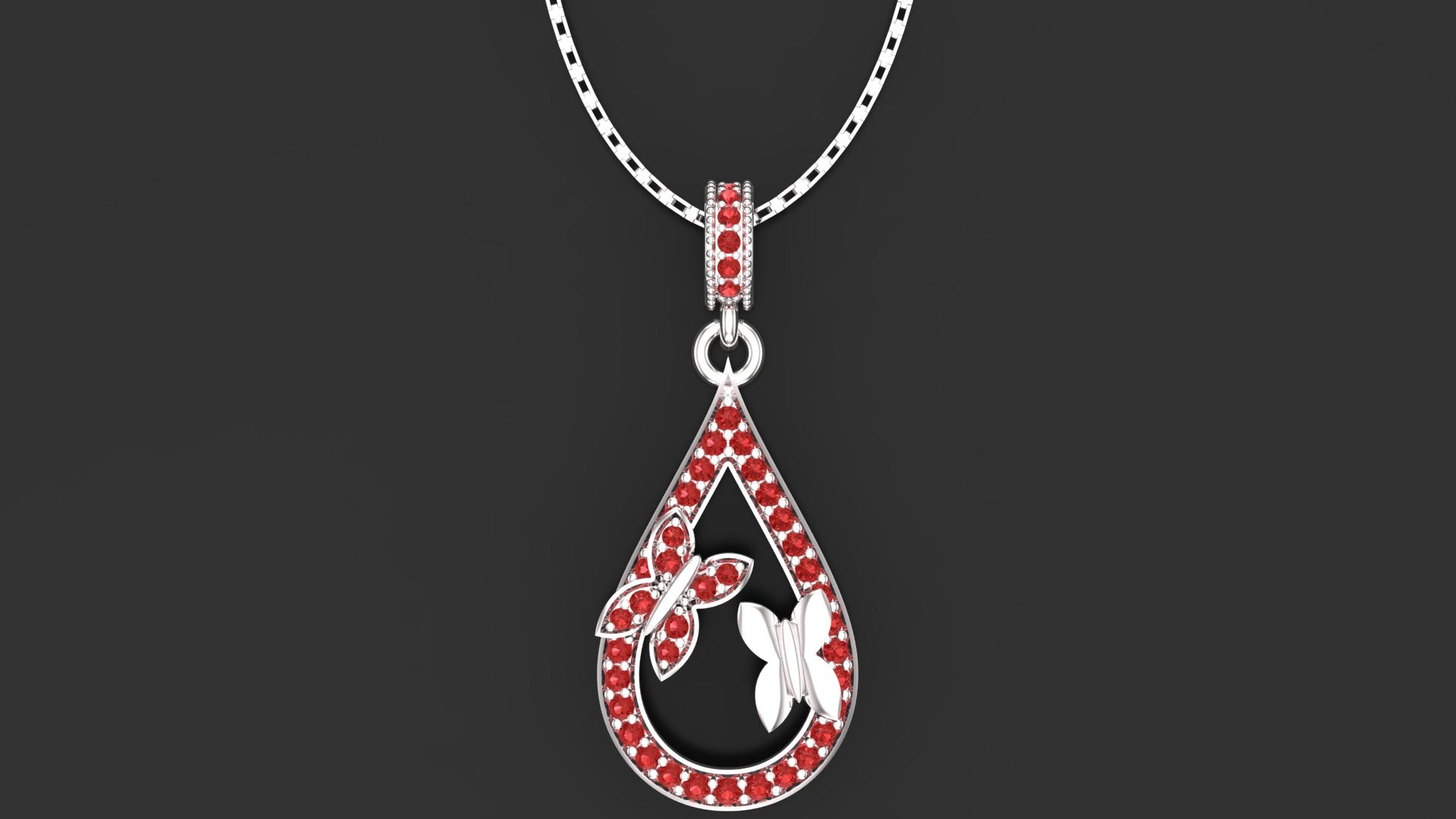 "Faraasha" silver butterfly teardrop pendant with ruby red gemstones.
